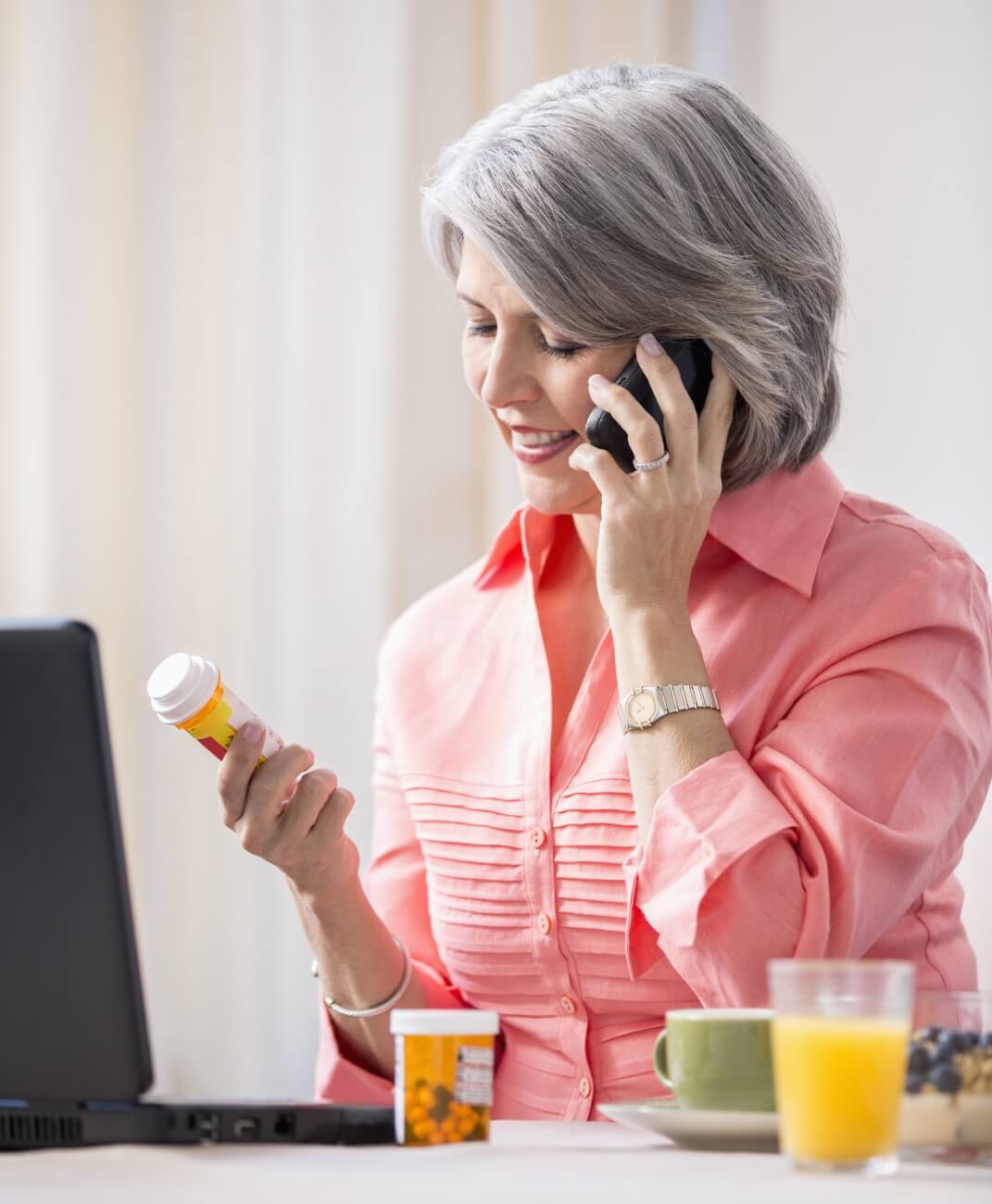 Woman discussing medication on cell phone